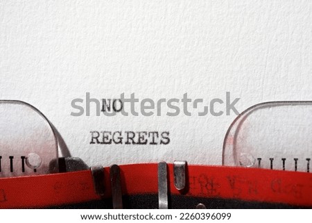 No regrets text written with a typewriter. Royalty-Free Stock Photo #2260396099