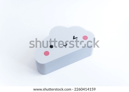 Cute weather emoticon icon. Cartoon cloud isolated on white background. Meteorology and sky concept