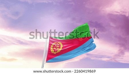 Eritrea national flag waving in the sky.