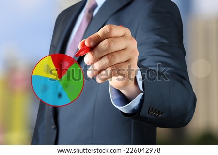 Businesswoman  drawing a virtua multi-colored l diagram  by  a red pen 