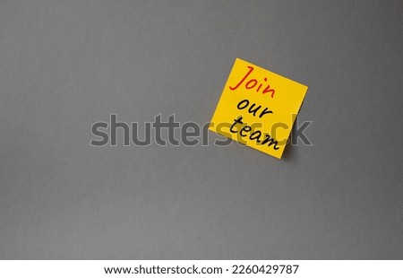 Join our team symbol. Concept words Join our team on orange steaky note. Beautiful grey background. Business and Join our team concept. Copy space.