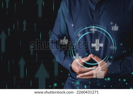 The man gets promoted to high level. Manifest body healing. Medium close up shot with virtual screen. Manipulation concept. Isolated on black background. Royalty-Free Stock Photo #2260431271