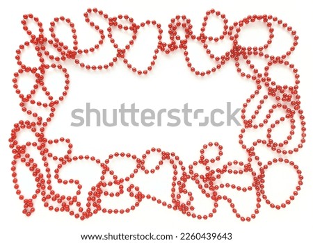 Red beads around like frame on white background. Empty space for text in the middle. Flat lay for Valentine's Day or holidays.