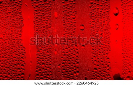 Ice cold glass fresh coca cola covered with water drops condensation Cold drink Drops of water cola drink background Raindrops texture Close up Royalty-Free Stock Photo #2260464925