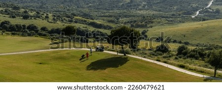 Golf course landscape, Spain. Picturesque scenery golf course green field with trees. Province of Alicante, Spain. Sport and lifestyle concept.