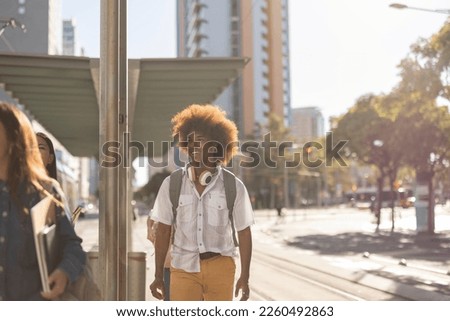 student man on his way to the train to go back to school