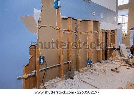 Providing repair remodeling services in kitchen of house renovation, construction new kitchen while old one is demolished Royalty-Free Stock Photo #2260502197