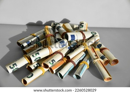 a bunch of rolled euro banknotes Royalty-Free Stock Photo #2260528029
