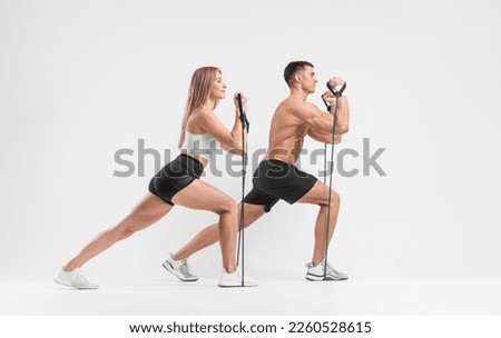 Fit couple at the gym isolated on white background. Fitness concept. Healthy life style. Download photo for sports social media or magazine