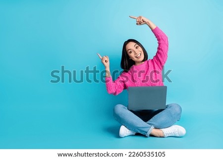 Full length photo of shiny charming woman dressed pink sweater chatting modern gadget empty space isolated blue color background