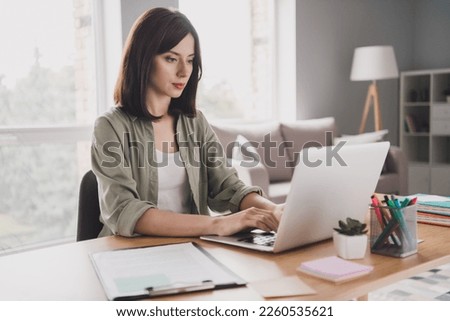 Photo of concentrated focused smart lady boss chief seo typing sms message netbook macbook chatting clients customer work from home indoor Royalty-Free Stock Photo #2260535621
