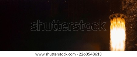 Rocket launch on dark background. Space shuttle rocket launch concept wallpaper. Elements of this image furnished by NASA Royalty-Free Stock Photo #2260548613