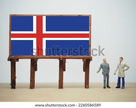 Mini toy at table with white background. Iceland flag design.