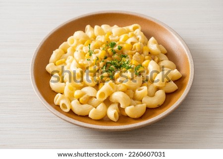 macaroni with creamy corn cheese on plate Royalty-Free Stock Photo #2260607031