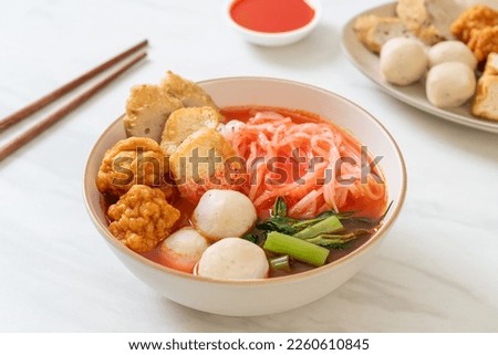 small flat rice noodles with fish balls and shrimp balls in pink soup, Yen Ta Four or Yen Ta Fo - Asian food style Royalty-Free Stock Photo #2260610845