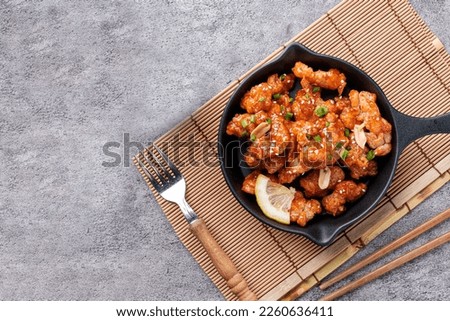 Top Table View of Korean fried chicken, While freshly cooked, appetizing, with Space for Your Text. Royalty-Free Stock Photo #2260636411