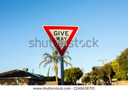 Triangle red and white give way sign with black text in a suburban street in Adelaide, South Australia