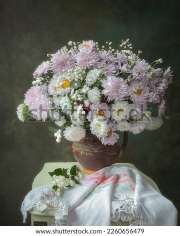 Still life with bouquet of pink chrysanthemums and asters