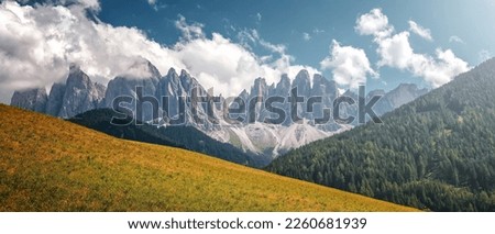 Amazing nature landscape. Wonderfull Dolomites Alps. Incredible autumn view. Incredible autumn view. green highland, forest and rocky mountains peaks on background. Picture of wild area