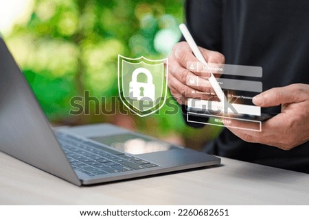 businessmen holding pens and touching login screens on smartphones to sign in to cyber networks. the virtual screen shows login to a security system. Working with smart device concept. Laptop on table