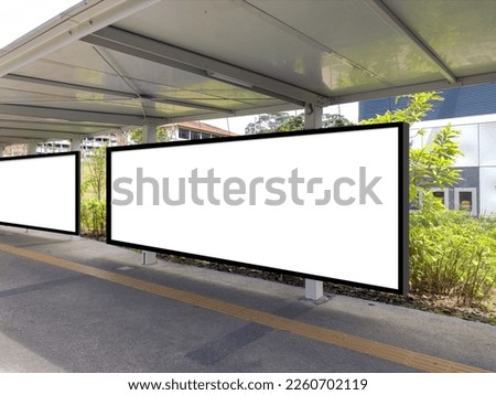 Long blank billboards for advertising at pedestrian walkway of MRT train station for mock up display purpose; outdoors out of home OOH media