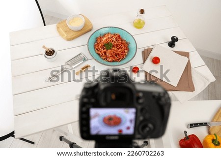 Professional camera and composition with spaghetti on table in studio. Food stylist