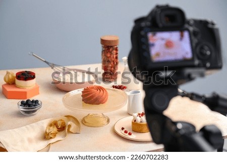 Professional equipment and composition with delicious dessert on beige table in studio. Food photography