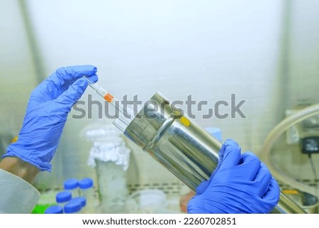 The researcher using sterile serological pipettes size 10 ml are suitable for non toxic solution in cell and bio molecular laboratories. The lab test in the laboratory room. Royalty-Free Stock Photo #2260702851