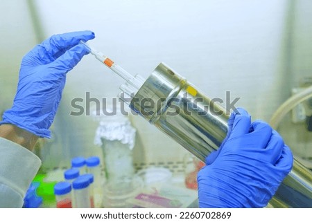 The researcher using sterile serological pipettes size 10 ml are suitable for non toxic solution in cell and bio molecular laboratories. The lab test in the laboratory room. Royalty-Free Stock Photo #2260702869