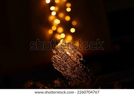 Ice with a warm, golden background.  The lights seem to rise upwards.