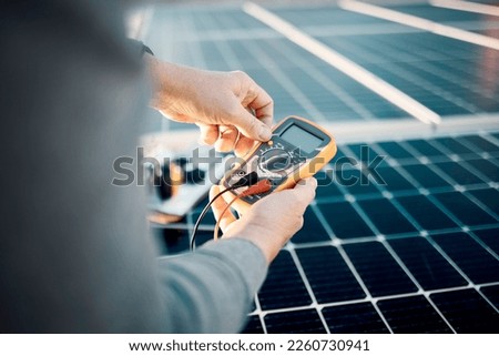Solar panels, multimeter and engineering hands for voltage check, installation or maintenance. Sustainability, eco friendly or energy saving technology, contractor inspection or troubleshooting tools Royalty-Free Stock Photo #2260730941