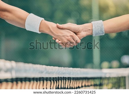 Hand, tennis and handshake for partnership, trust or greeting in sportsmanship over net on the court. Players shaking hands before sports game, match or unity for deal or agreement in solidarity Royalty-Free Stock Photo #2260731425