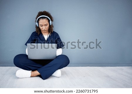Woman, laptop and headphones of hospital music, podcast or radio in woman study research or mockup nurse learning. Doctor, technology and medical student listening to healthcare audio for focus help