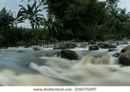 Rocky river stream of Kali Bojong, Salatiga, Central Java. Indonesia. Long Exposure Photography. Blurred motions.