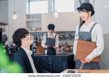 Cafe staff working with a smile