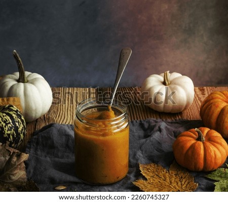 Pumpkin puree in glass jar pie ingredient closeup