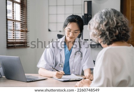Doctor working to write a patient report in the clinic.