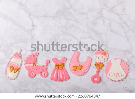 Baby shower cookies on a white marble background. Delicious cookies for a baby party. Baby shower party concept. Flat lay. View from above. candy bar
