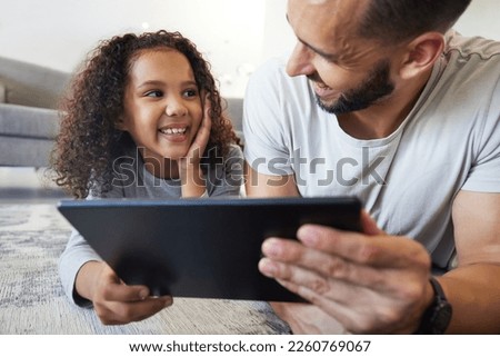 Kid, father or bonding on tablet in house, home or floor for live streaming, watching movies or education social media. Smile, happy child or man on technology for video call, children website or app