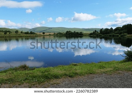 The John Muir Way walking trail passes the reservoir by the A818 road just north of Helensburgh, Argyll and Bute, Scotland. Royalty-Free Stock Photo #2260782389