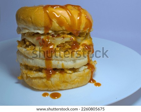 Burger in an isolated background well composed for tempting advertisement pictures and wallpapers for cafe and restaurant.