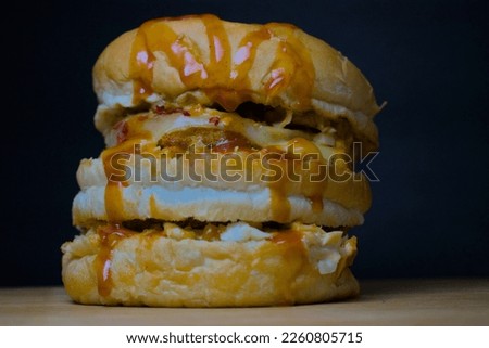 Burger in an isolated background well composed for tempting advertisement pictures and wallpapers for cafe and restaurant.