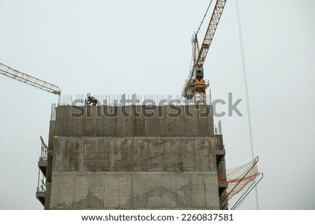Building house. New building. Concrete frame. Construction of high-rise building.