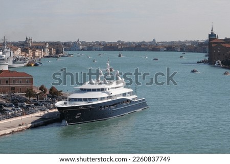 Big yacht parked at a dock in Venice, Italy Royalty-Free Stock Photo #2260837749