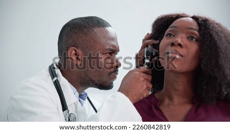 Otolaryngology Ear Check Using Otoscope. Doctor Examining Patient Royalty-Free Stock Photo #2260842819