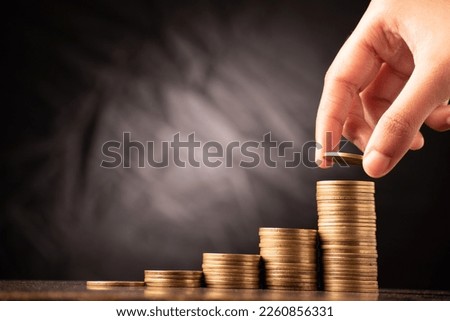 Mutual fund or systematic investment plan concept, putting coin on coin stack Royalty-Free Stock Photo #2260856331