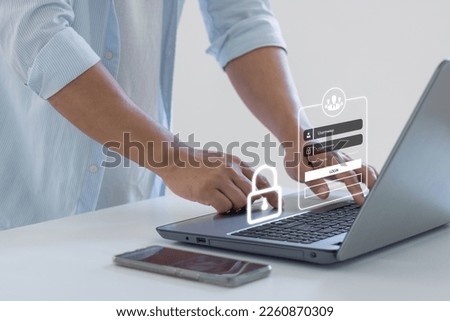 User typing username and password on login screen, login, username, password, identification information security and encryption, idea of cyber security, data protection, and secured internet access. Royalty-Free Stock Photo #2260870309