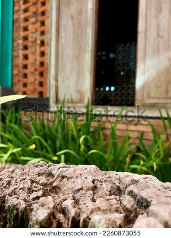 Blurred photo of Indonesian traditional eco house with old wood plank use to display. defocused background