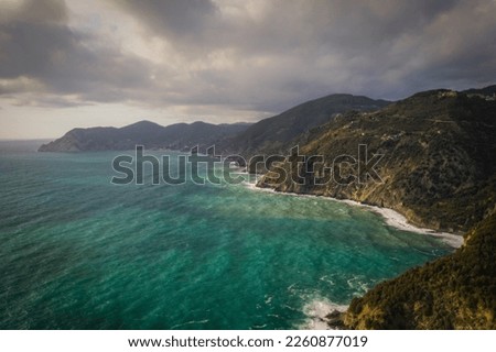 Beautiful view of of rocky mountainous coast and blue sea near Corniglia, Italy. September 2022, aerial drone picture