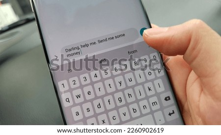A scammer trying to get victims to send money Royalty-Free Stock Photo #2260902619